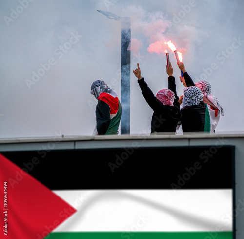An anonymous march holding torch and Palestinian flags