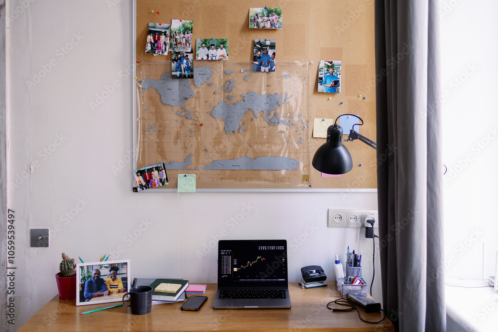 © Oleksii Syrotkin/Stocksy - Blackboard over table with open laptop with graph at home workplace © Oleksii Syrotkin/Stocksy - Blackboard over table with open laptop with graph at home workplace