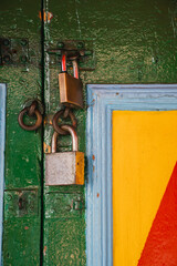  Two Colorful Locks on Wooden Door