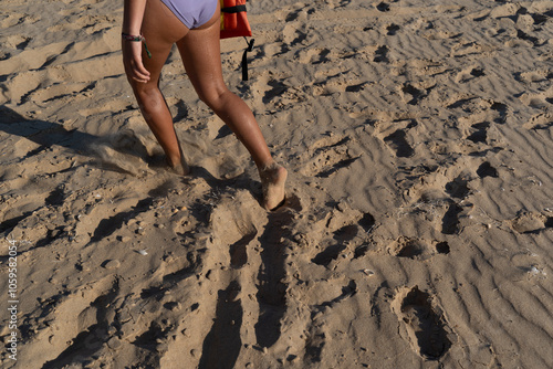 Girl Walking on Sandy Beach with Bare Feet