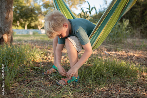 boy relaxing in the hammock photo