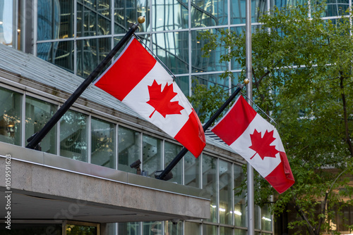 Canadian flags on building in downtown district of Ottawa in Canada.