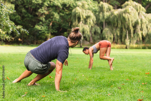 Couple Warming Up with Capoeira in Park