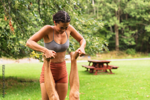 Woman Giving Foot Massage After Acrobatic Yoga Session