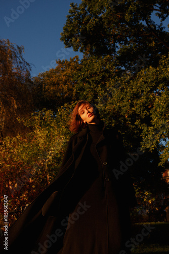 Model posing on a golden hour in beautiful garden photo