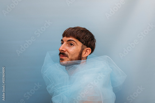 Portrait of a young man with blue background  photo