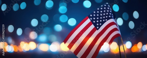 American flag illuminated against the night sky at a remembrance event, honoring the brave