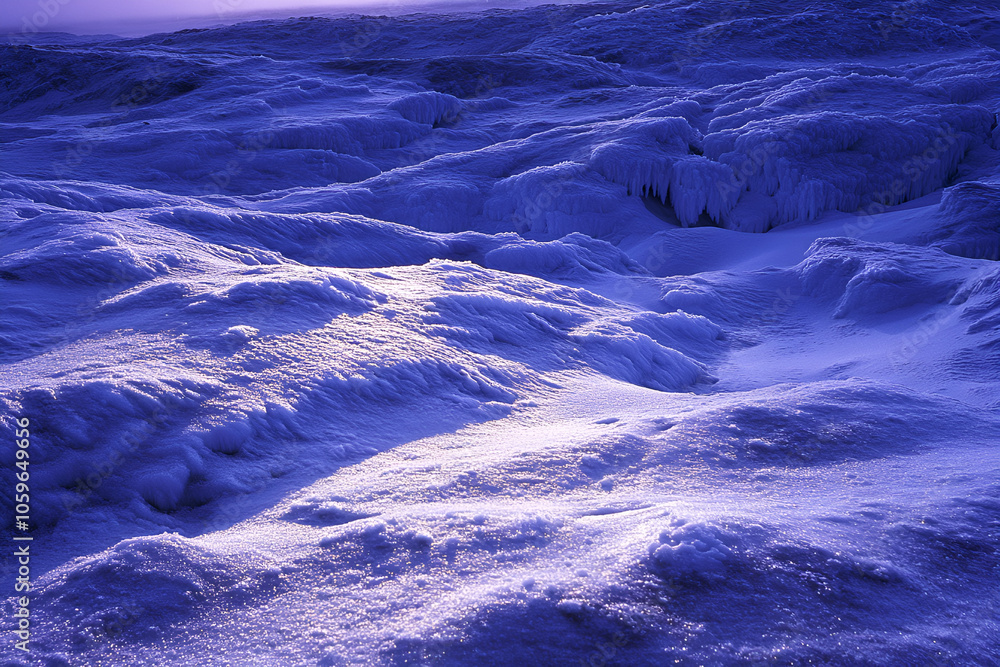 Fototapeta premium Majestic Snowy Landscape at Dusk With Deep Blue Shadows - under the twilight sky, capturing the tranquil beauty of winter and serenity of nature
