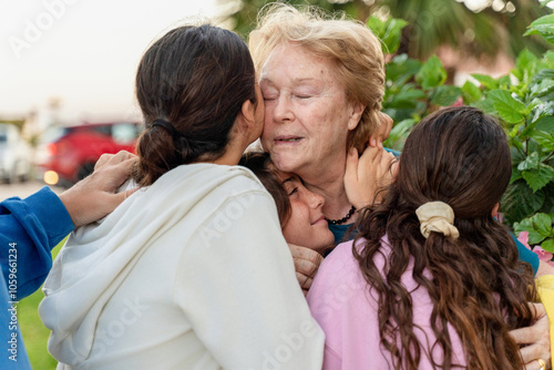 Emotional Farewell Group Hug with Grandmother photo