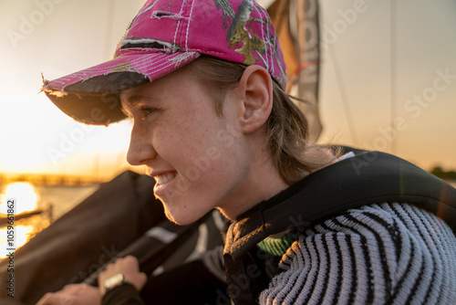 Smiling Person on a Boat at Sunset