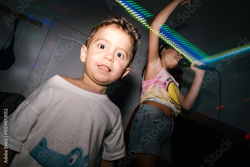 Child Enjoying Party with Colorful Lights photo