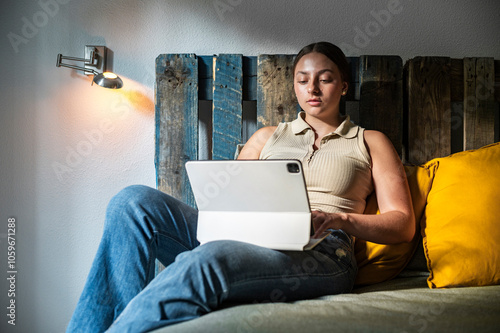 Social media worker posting on digital tablet photo