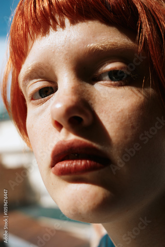 Closeup Beauty Portrait of Redhead Woman in Sunlight photo