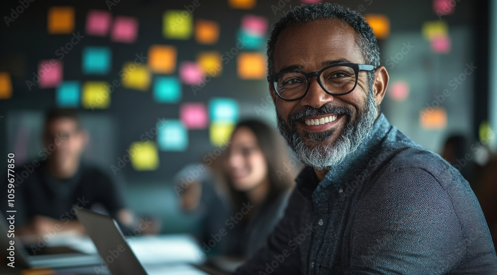 Fototapeta premium The collaborative energy of a modern workspace shines as a smiling person sits with the team brainstorming and colorful notes in the background.