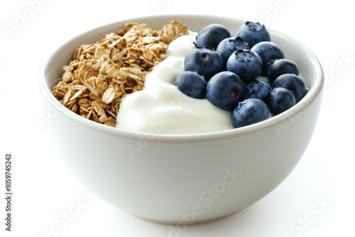 Bowl of yogurt with blueberries and granola.