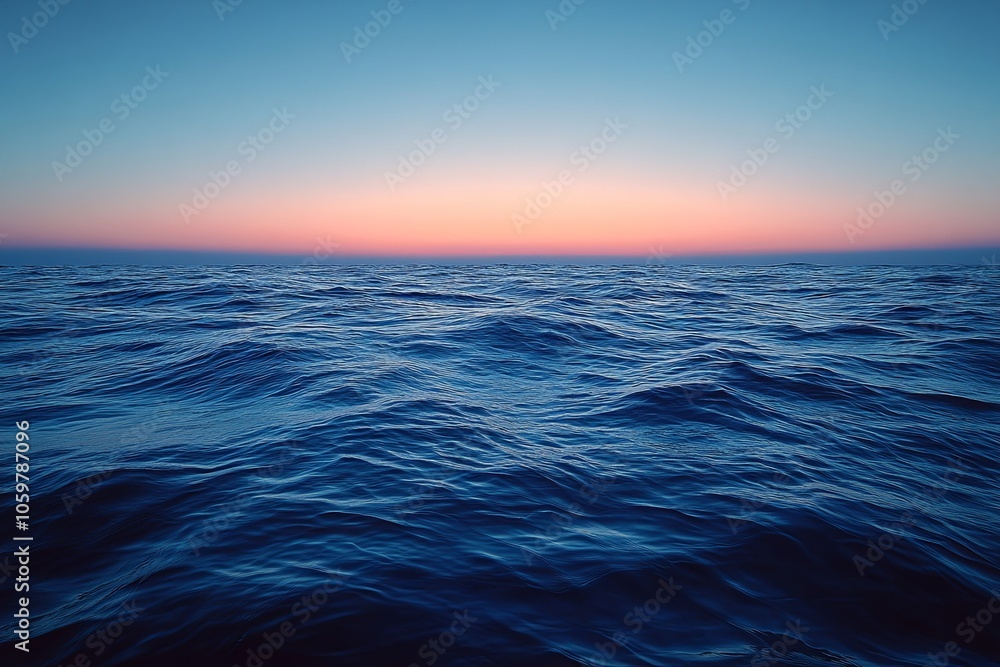 Obraz premium Tranquil ocean waves at sunset reflecting hues of blue and orange near the horizon in a serene coastal setting. Generative AI