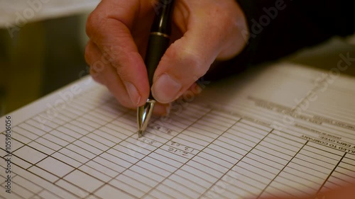 A Woman Contractor fills out her weekly expense report - 2 photo