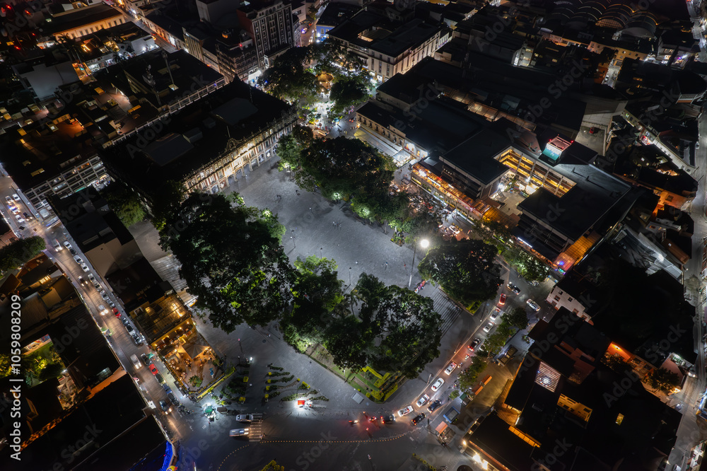 An enchanting aerial drone view of the Municipal Palace in Cuernavaca, Mexico, illuminated at night, showcasing the historic architecture and cityscape An enchanting aerial drone view of the Municipal Palace in Cuernavaca, Mexico, illuminated at night, showcasing the historic architecture and cityscape