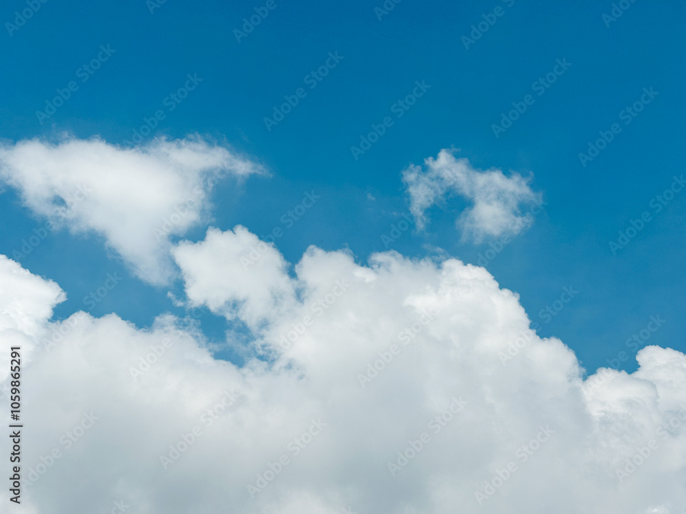 Obraz premium Beautiful blue sky background with clouds