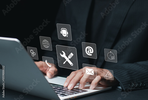 Maintenance concept. Repair about assistance and servicing of equipments, technical support, assistance and service. Businessman using laptop with maintenance icon on virtual screen..