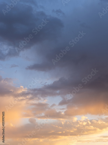Early sunset colors the clouds in a spectacular cool to warm gradient