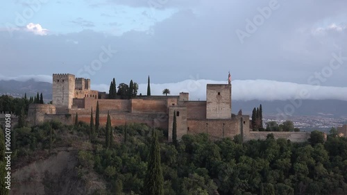 Alhambra Castle in Granada at sunset from San Nicolas viewpoint, Andalucia, Spain. High quality 4k footage