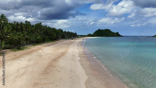 Spectacular Drone Footage of a Wide White Sand Beach with Palm Trees and Lush Greenery in the Philippines – Captured in 4K on a Sunny Day