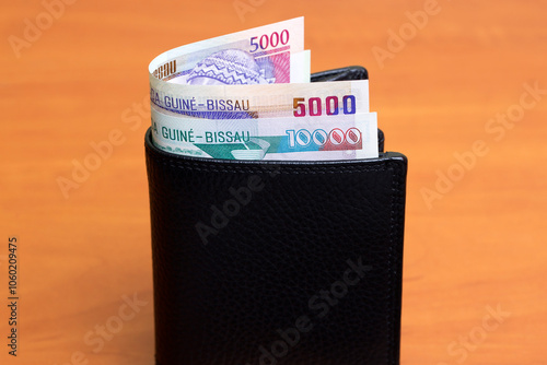 Guinea-Bissau peso in the black wallet