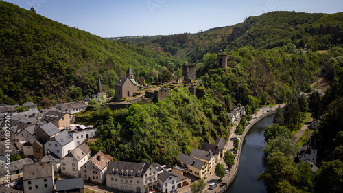 Aerial view of Esch-sur-Sure, medieval town in Luxembourg, dominated by castle, canton Wiltz in Diekirch. Forests of Upper-Sure Nature Park, meander of winding river Sauer, near Upper Sauer Lake.