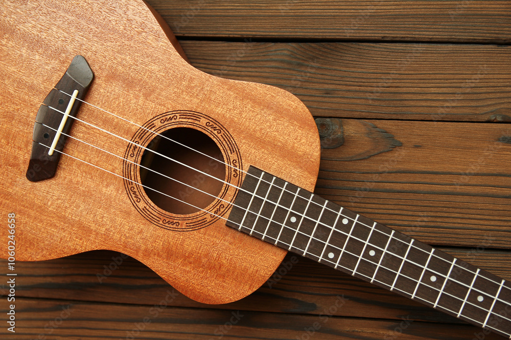 Fototapeta premium ukulele guitar on wooden background