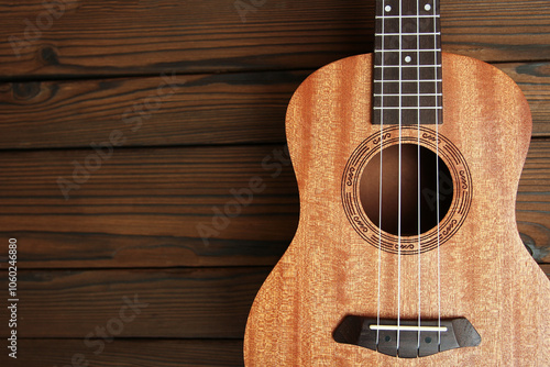 ukulele guitar on  wooden background photo