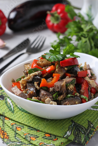 Fotografía Warm salad with tongue, eggplant and sweet pepper in white plate
