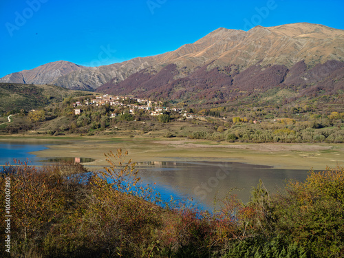 View of a little mountain village on Campotosto lake during Autumn season, Abruzzo region, Italy photo