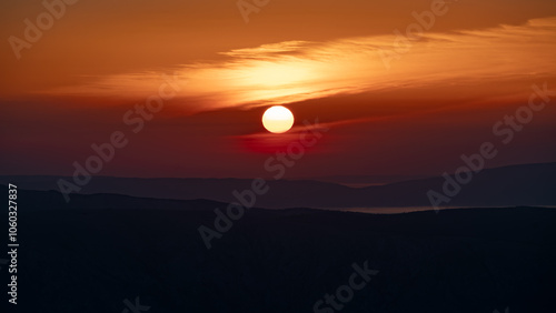 Hazy sunset over the Croatian Adriatic islands Krk and Cres.