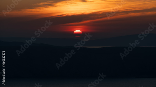 Hazy sunset over the Croatian Adriatic islands Krk and Cres.