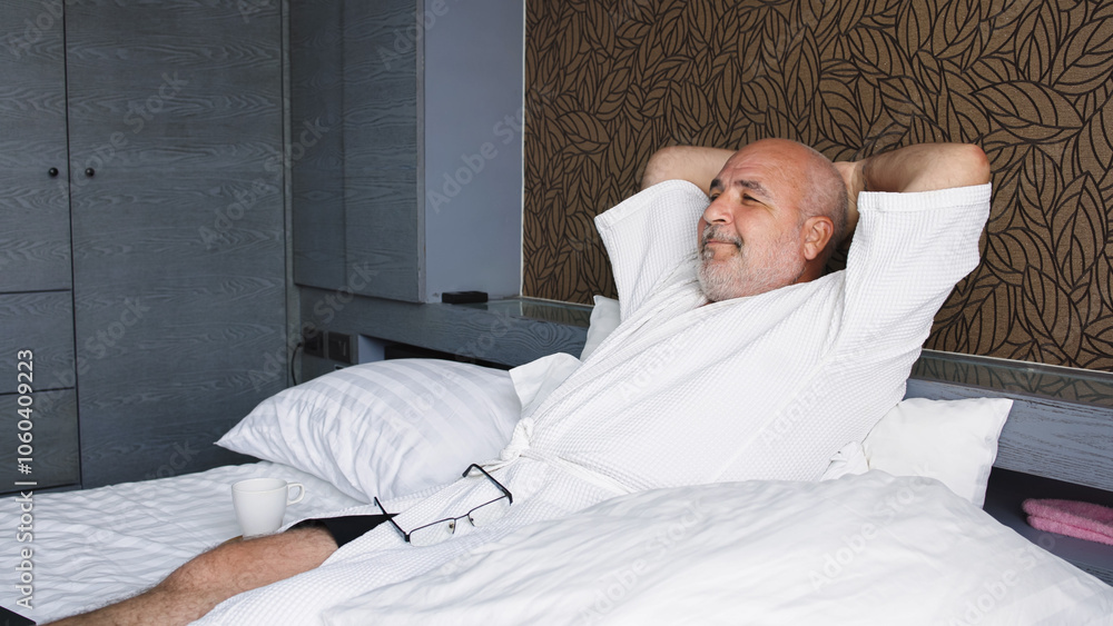 A middle-aged man works remotely on his laptop, focused and productive. This scene captures the essence of freelance life, blending professionalism with the comforts of home. A middle-aged man works remotely on his laptop, focused and productive. This scene captures the essence of freelance life, blending professionalism with the comforts of home.