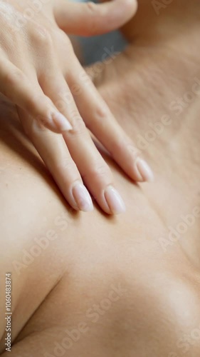 Wallpaper Mural Woman gently touching body. Female relaxing at spa salon. Spa treatment concept. Young woman relaxing in beauty salon lying on massage table. Skin care. Vertical video. Close-up in 4K, UHD Torontodigital.ca