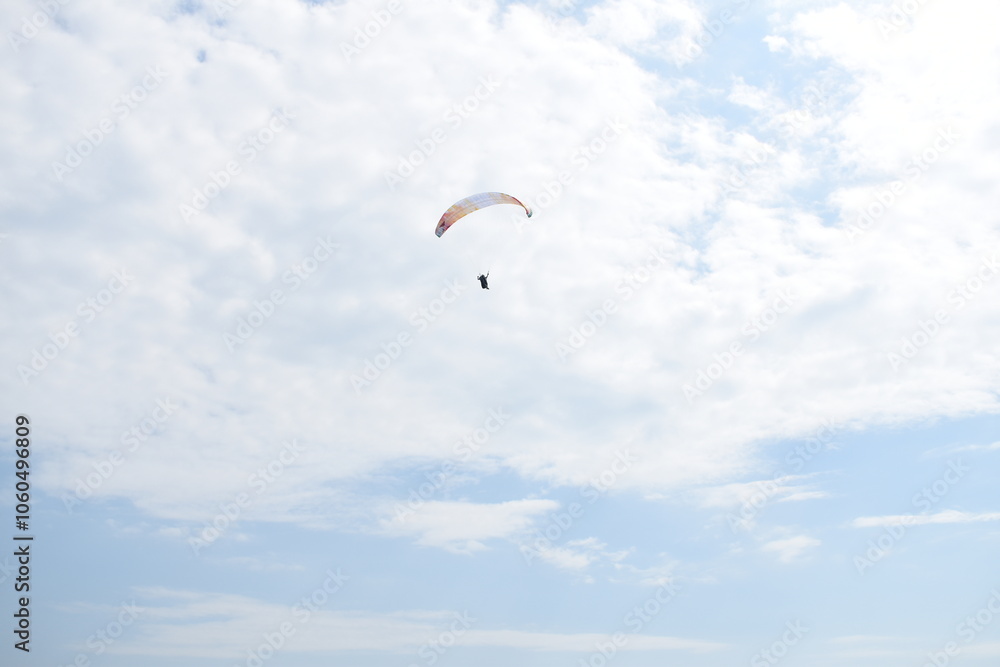 Paraglider ascending up the sky Paraglider ascending up the sky