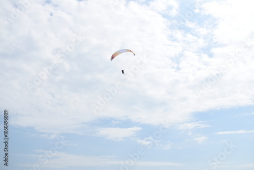 Paraglider ascending up the sky