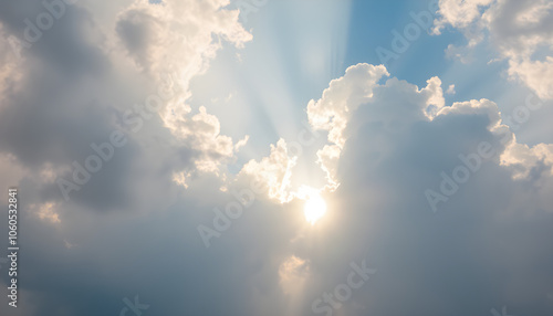 Soft sunlight breaking through clouds, atmospheric sky scene, peaceful nature.AI Generated