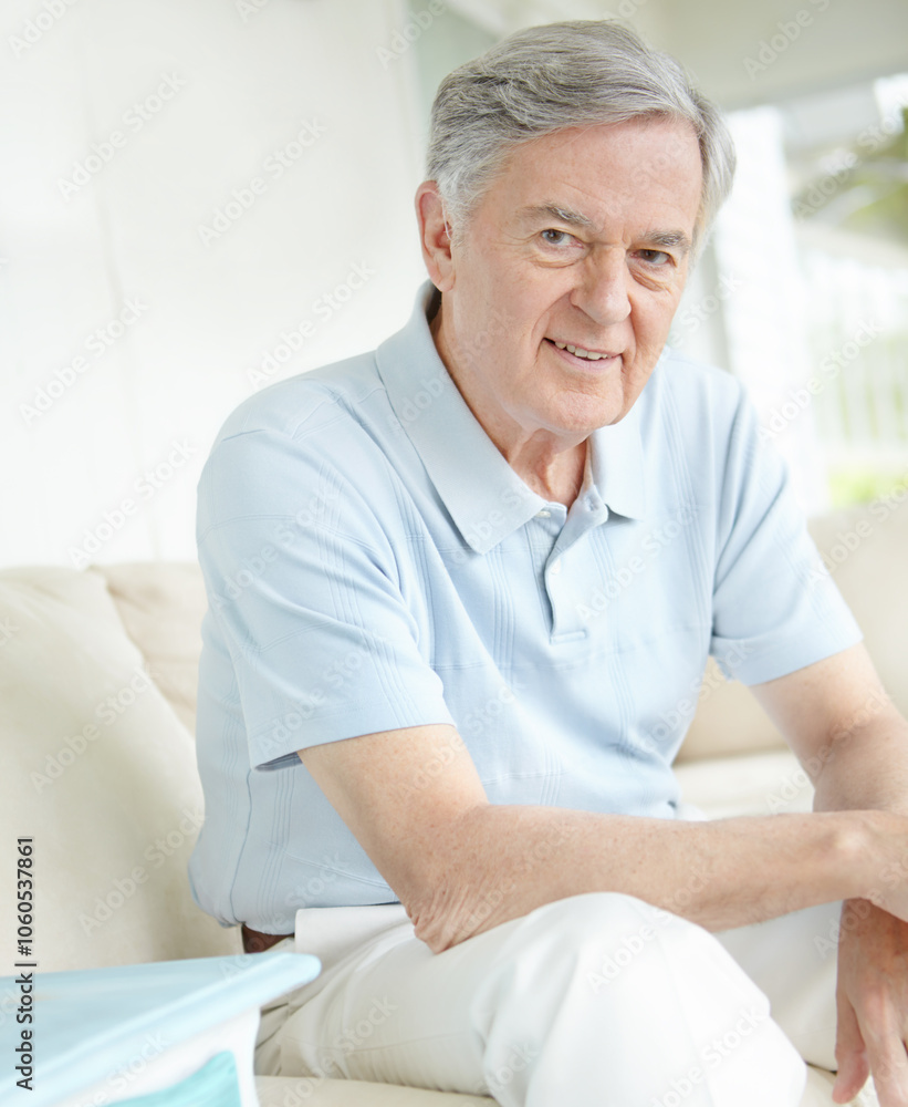 Portrait, relax and wellness with senior man on sofa in living room of home for comfort or rest. Happy, retirement and smile with face of confident mature person in apartment for weekend time off Portrait, relax and wellness with senior man on sofa in living room of home for comfort or rest. Happy, retirement and smile with face of confident mature person in apartment for weekend time off