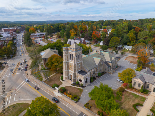 Village Congregational Church aerial view at 5 Church Street in fall with foliage in historic village of Whitinsville, town of Northbridge, Massachusetts MA, USA. 