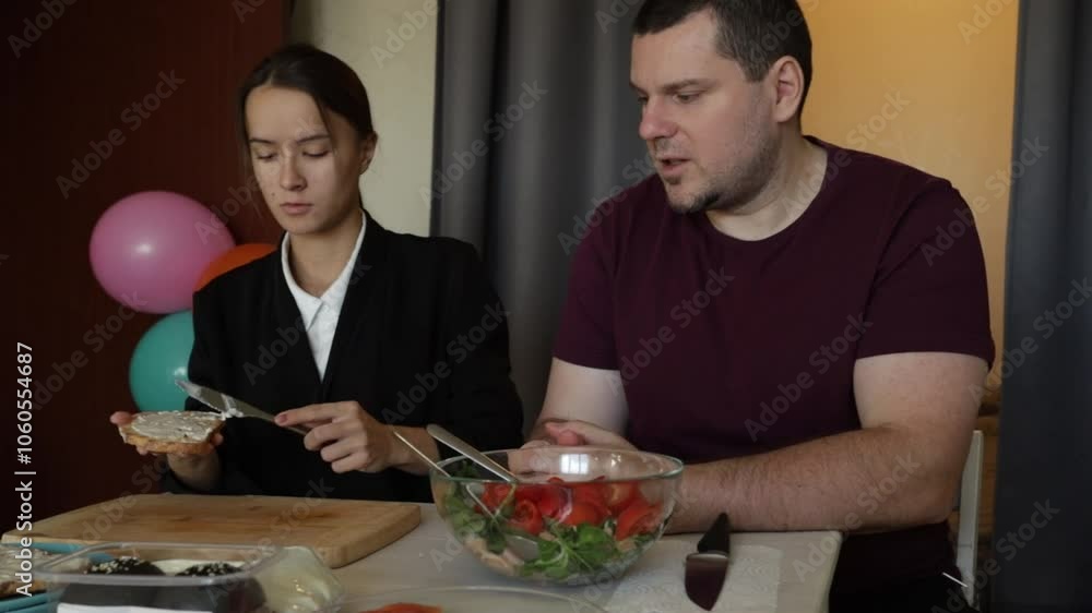 Family dinner, father and daughter preparing food for the holiday, making salad for dinner Family dinner, father and daughter preparing food for the holiday, making salad for dinner