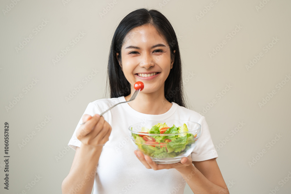 Diet concept, happy asian young woman, girl hand use fork at tomato with fresh vegetable, green salad, eat nutrition food low fat to good body on background. female getting weight loss for healthy. Diet concept, happy asian young woman, girl hand use fork at tomato with fresh vegetable, green salad, eat nutrition food low fat to good body on background. female getting weight loss for healthy.