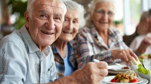 Happy senior people group having fun at pic nic barbecue garden diner - Food life style concept with mature friends cooking out at barbeque grill fest - Warm vivid filter with focus on left woman