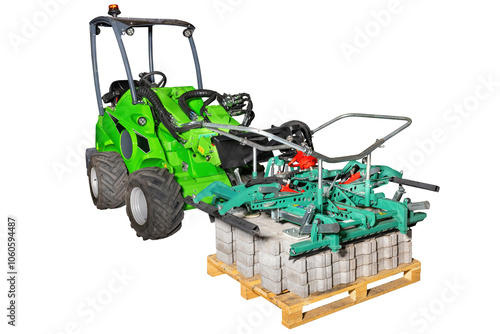 Obraz na płótnie Powerful loader lifting heavy concrete blocks with industrial machine on pallet. Isolated white background. Construction equipment concept. w salonie