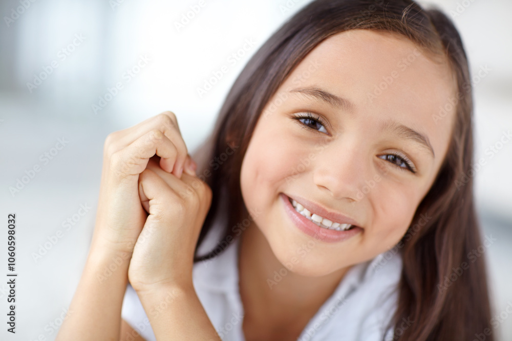 Happy, confident or portrait of girl in home for joy, growth and fun in living room of house to relax. Smile, young or face of healthy female kid alone for playing, satisfaction or childhood in Spain Happy, confident or portrait of girl in home for joy, growth and fun in living room of house to relax. Smile, young or face of healthy female kid alone for playing, satisfaction or childhood in Spain
