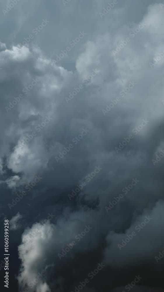 Dramatic dark storm clouds are moving fast, timelapse. Vertical video Dramatic dark storm clouds are moving fast, timelapse. Vertical video
