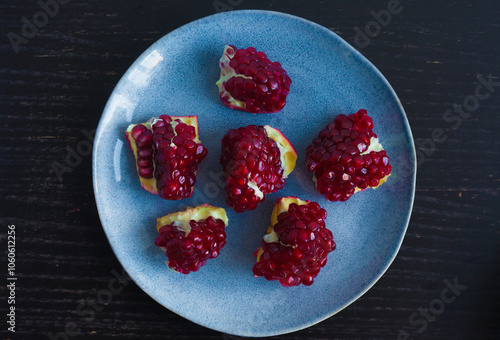 pieces of pomegranate on a plate photo