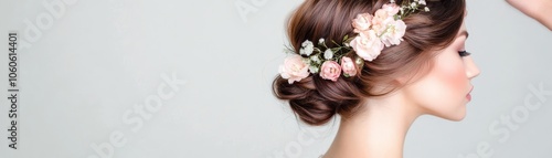 Elegantly styled hair adorned with delicate flowers, perfect for weddings, parties, or special occasions.